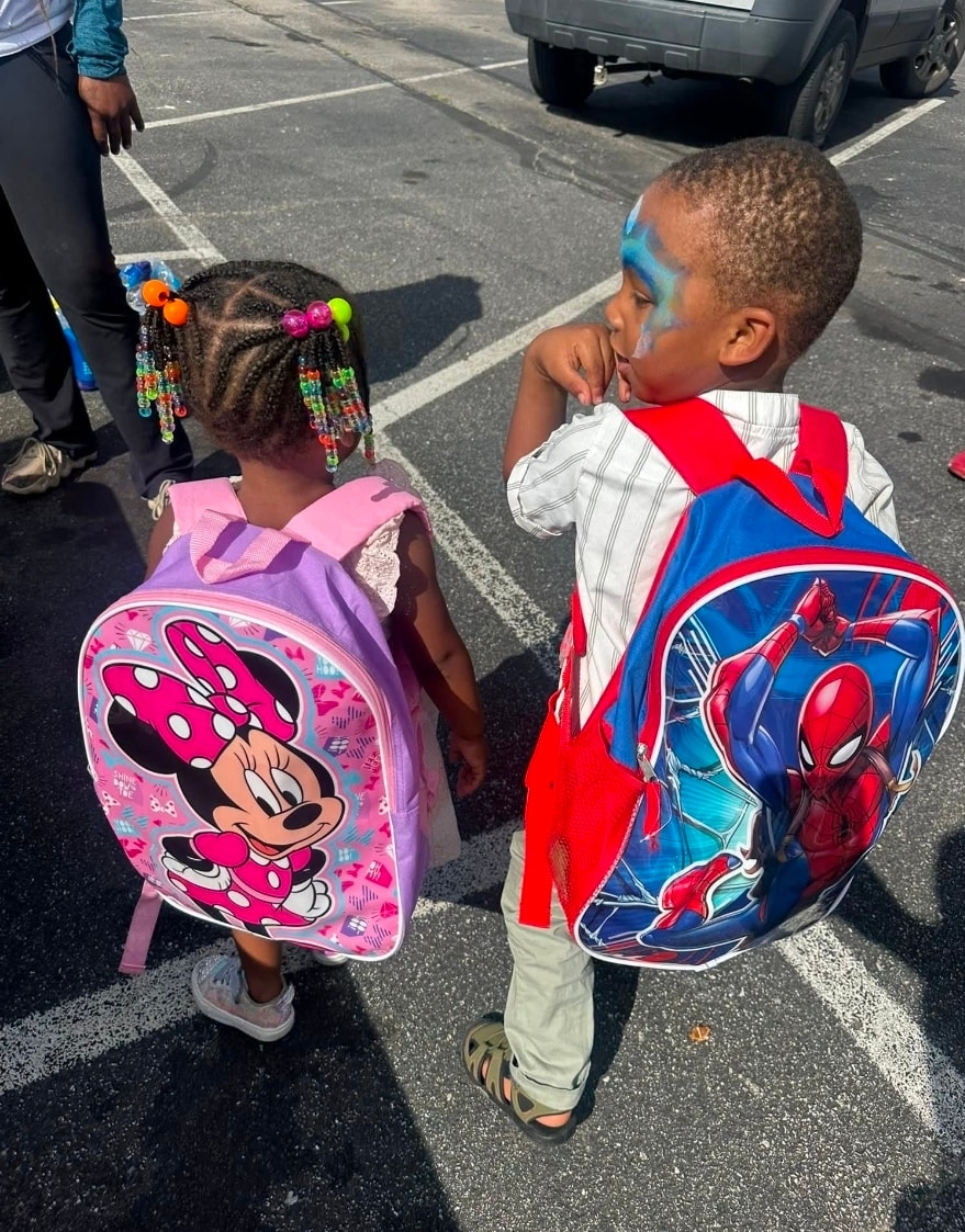 Kids with backpacks at School Daze event